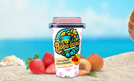 Bobalicious bubble tea cups featuring popping fruit bubbles in tropical flavours, displayed on a beach setting.