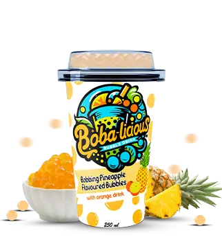 Bobalicious Pineapple Bubble Tea with orange flavor and tropical fruit slices, topped with pineapple and popping bubbles.