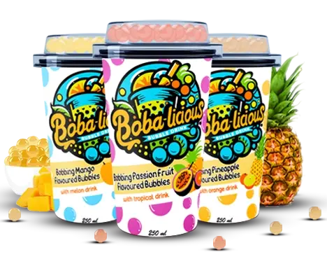 Assortment of mango, passion fruit, and pineapple bubble tea cups with popping bubbles for a fun twist.