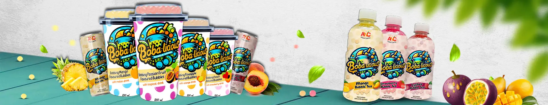 Assorted Bobalicious Bubble Tea cups, cans, and bottles in vibrant fruity flavours, displayed with fresh fruit and popping bubbles.
